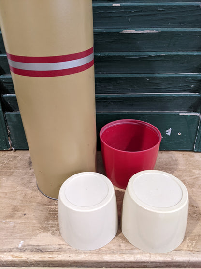 Tan with red and black stripe thermos